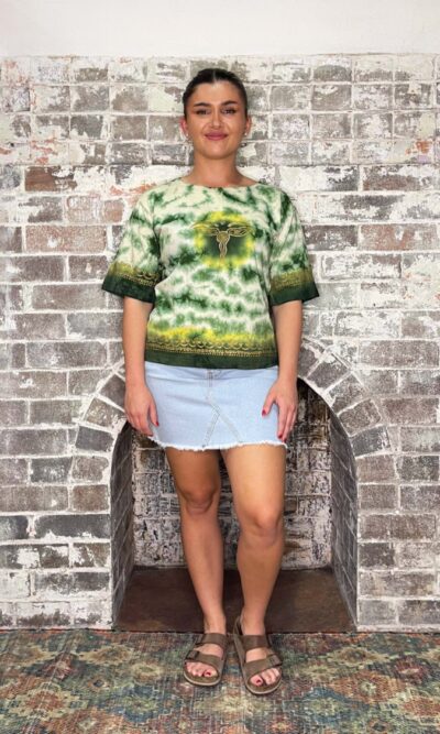 green tie dye t-shirt with eyes of Buddha symbol on front